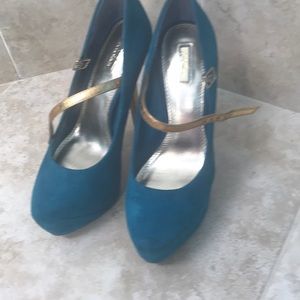 High heeled blue suede like shoes